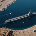 US Navy ship escorts oil tanker through Strait of Hormuz waters